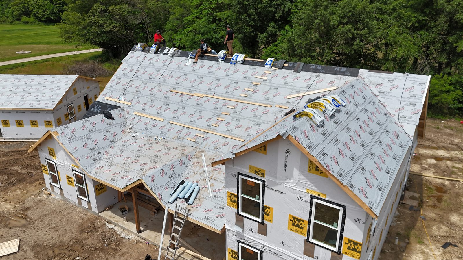 New build shingled roof — progress drone shot